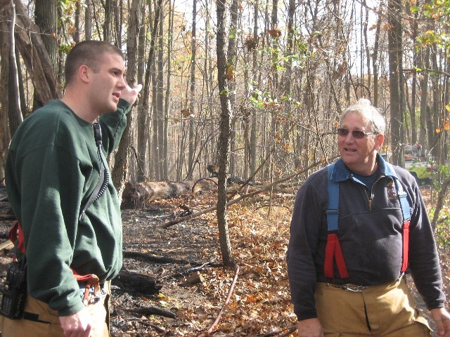Incident Commander Lt. Robbie Ruch confers with Paid Supervisor Donald Isennock